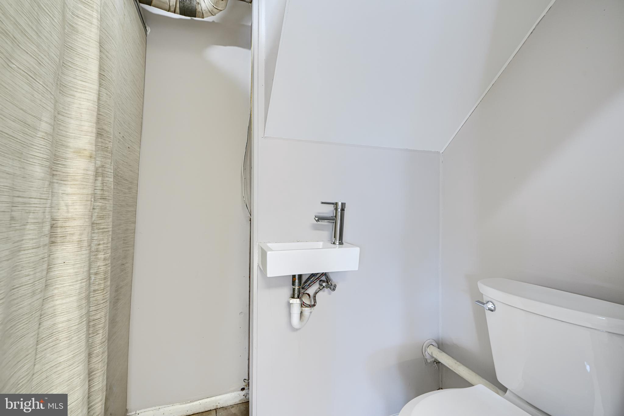 2014 Larkhall Road Dundalk, MD 21222 - Photo 14 of 44 a bathroom with a toilet and a shower