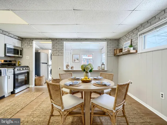a kitchen with stainless steel appliances granite countertop a refrigerator and cabinets