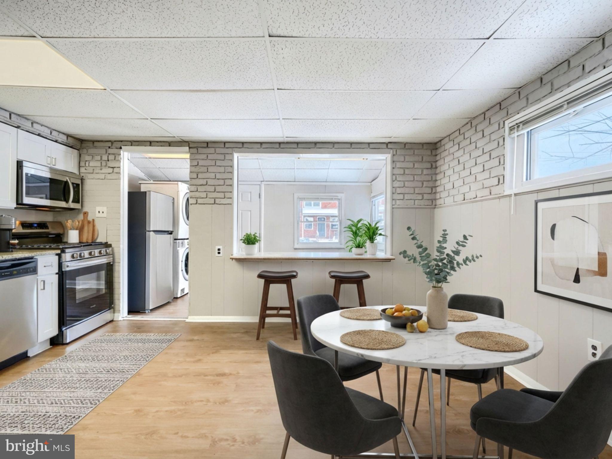 2014 Larkhall Road Dundalk, MD 21222 - Photo 10 of 44 a view of a dining room with furniture and a kitchen counter space