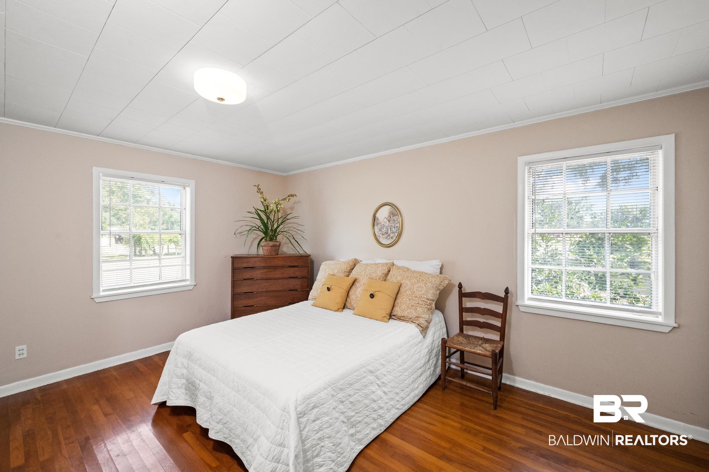 15600 Fackler Road Loxley, AL 36551 - Photo 14 of 51 Bedroom featuring dark hardwood / wood-style flooring and ornamental molding