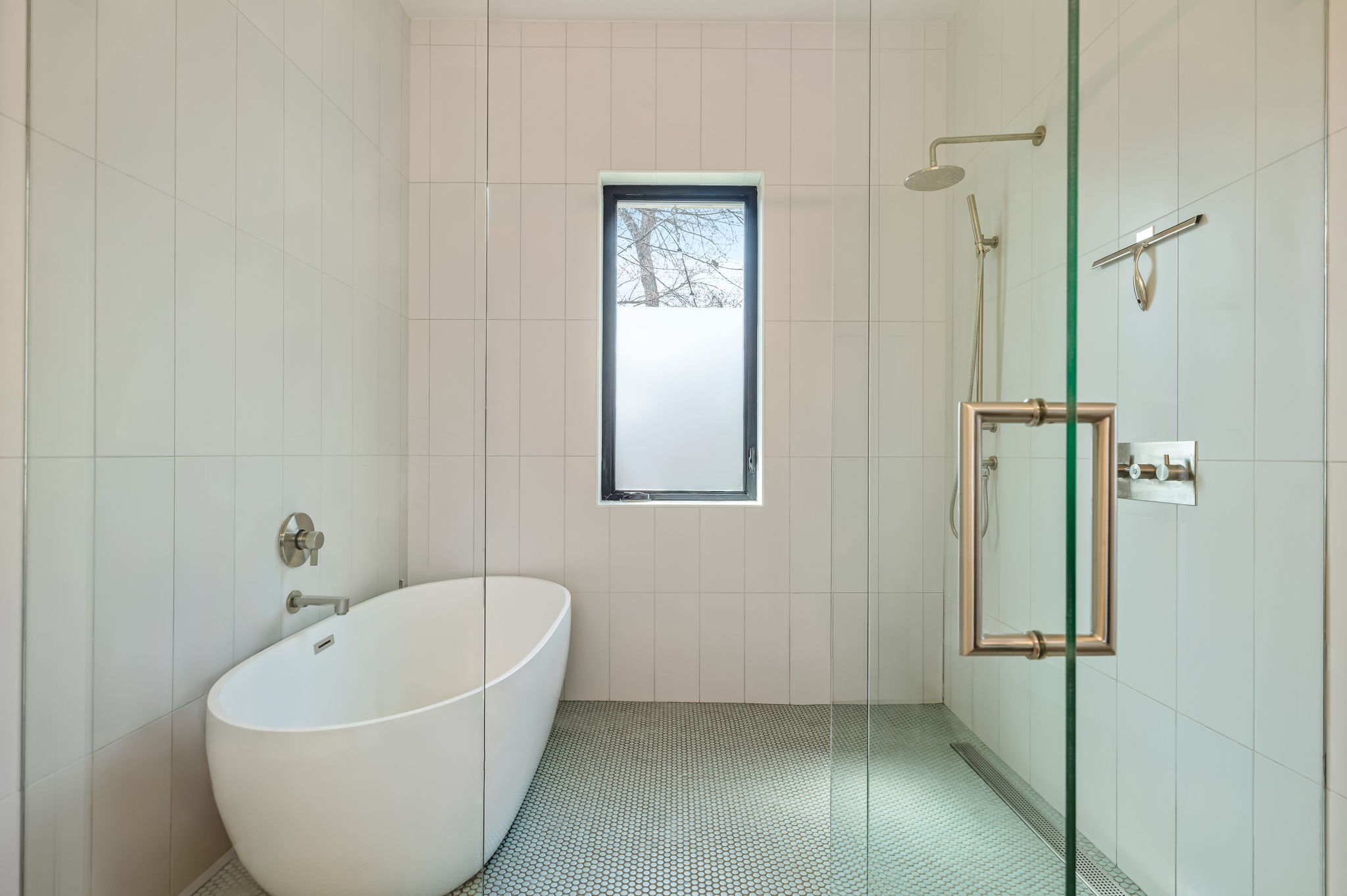 1811 Collier Street Austin, TX 78704 - Photo 19 of 40 Full bathroom featuring a soaking tub, walk in shower, tile walls, and tile patterned flooring