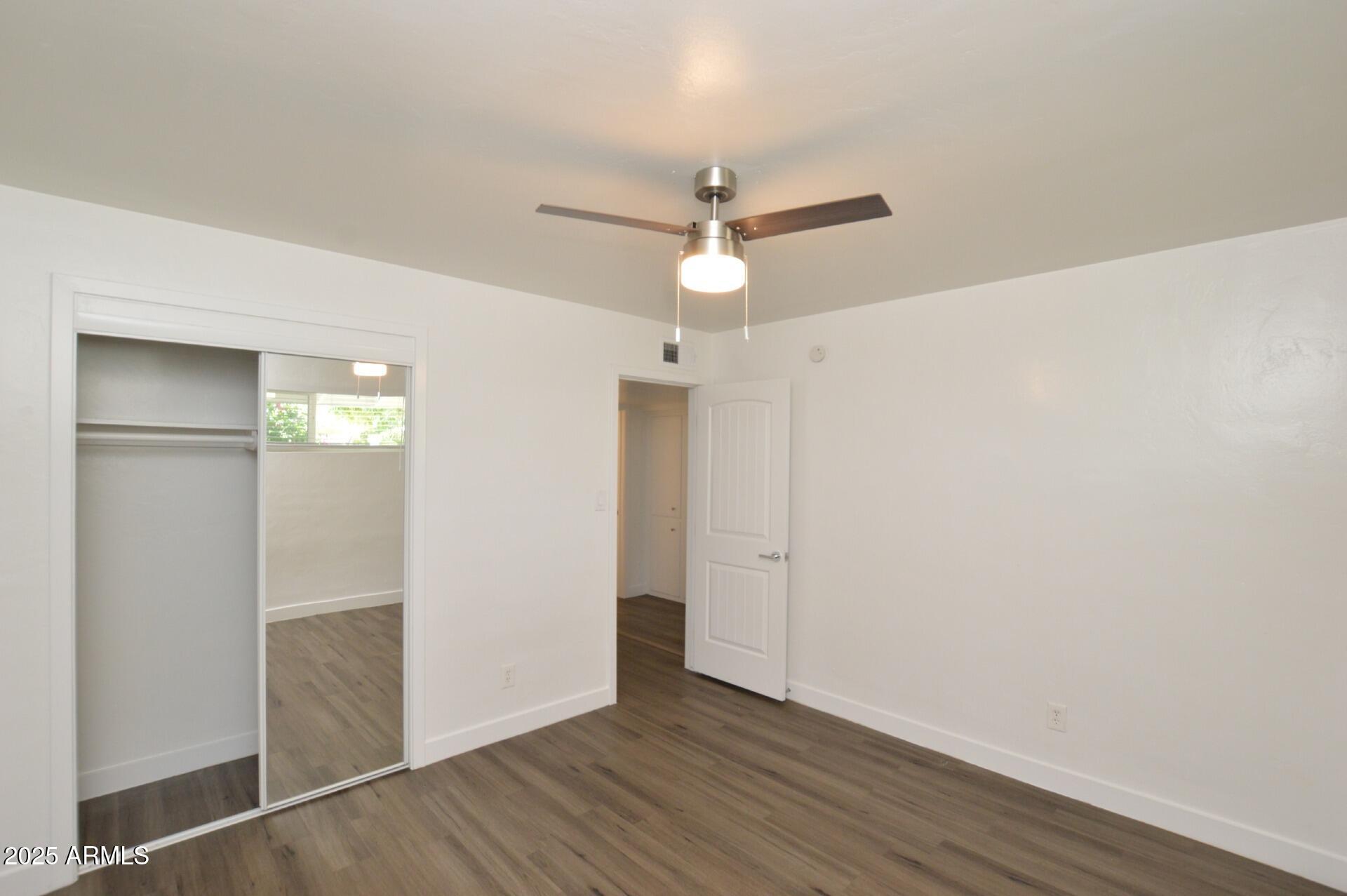 1202 East Kaler Drive, Unit 1 Phoenix, AZ 85020 - Photo 11 of 16 wooden floor in an empty room