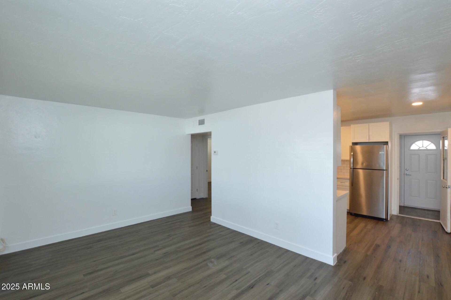 1202 East Kaler Drive, Unit 1 Phoenix, AZ 85020 - Photo 7 of 16 a view of empty room with wooden floor