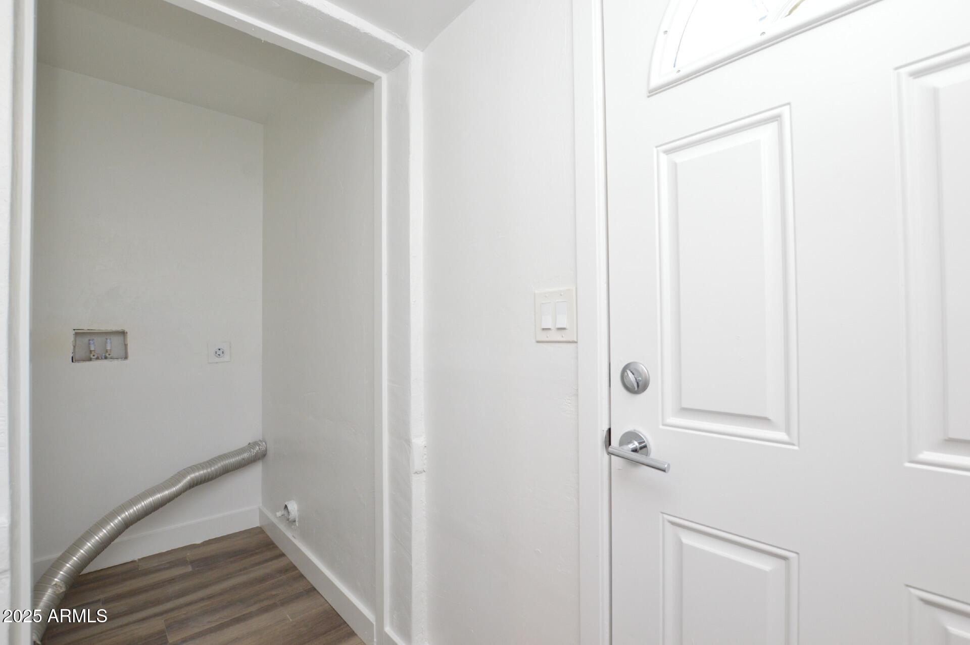 1202 East Kaler Drive, Unit 1 Phoenix, AZ 85020 - Photo 9 of 16 a view of a hallway with wooden floor