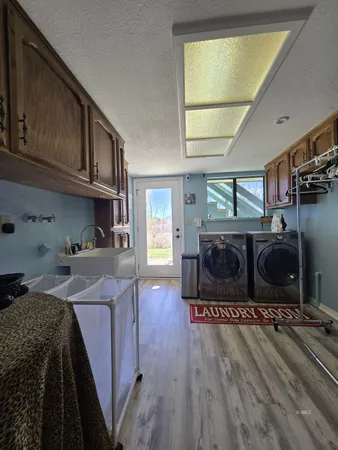 a living room with hard wood flooring and a fireplace