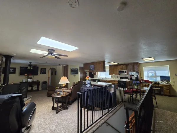 a living room with lots of furniture and a wooden floors
