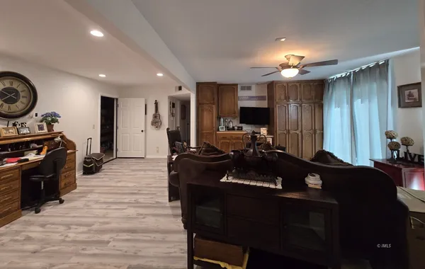 a kitchen with a sink appliances and cabinets