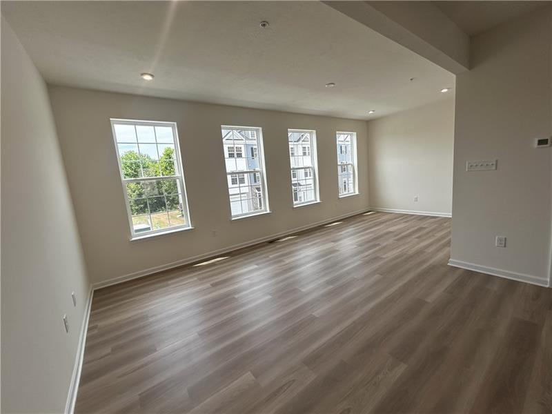 118 Affinity Drive Harmony, PA 16037 - Photo 5 of 8 a view of an empty room with wooden floor and a window