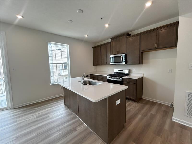 118 Affinity Drive Harmony, PA 16037 - Photo 8 of 8 a kitchen with stainless steel appliances granite countertop a sink stove and refrigerator