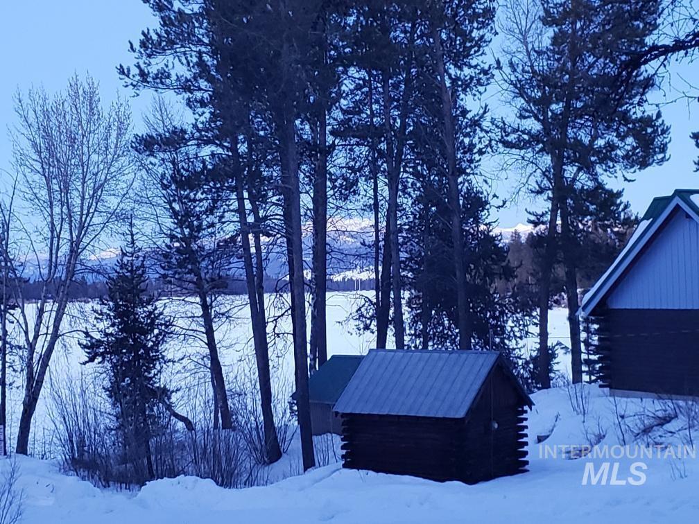 136 Paradise Lane Donnelly, ID 83615 - Photo 2 of 49 View of snow covered exterior featuring log siding
