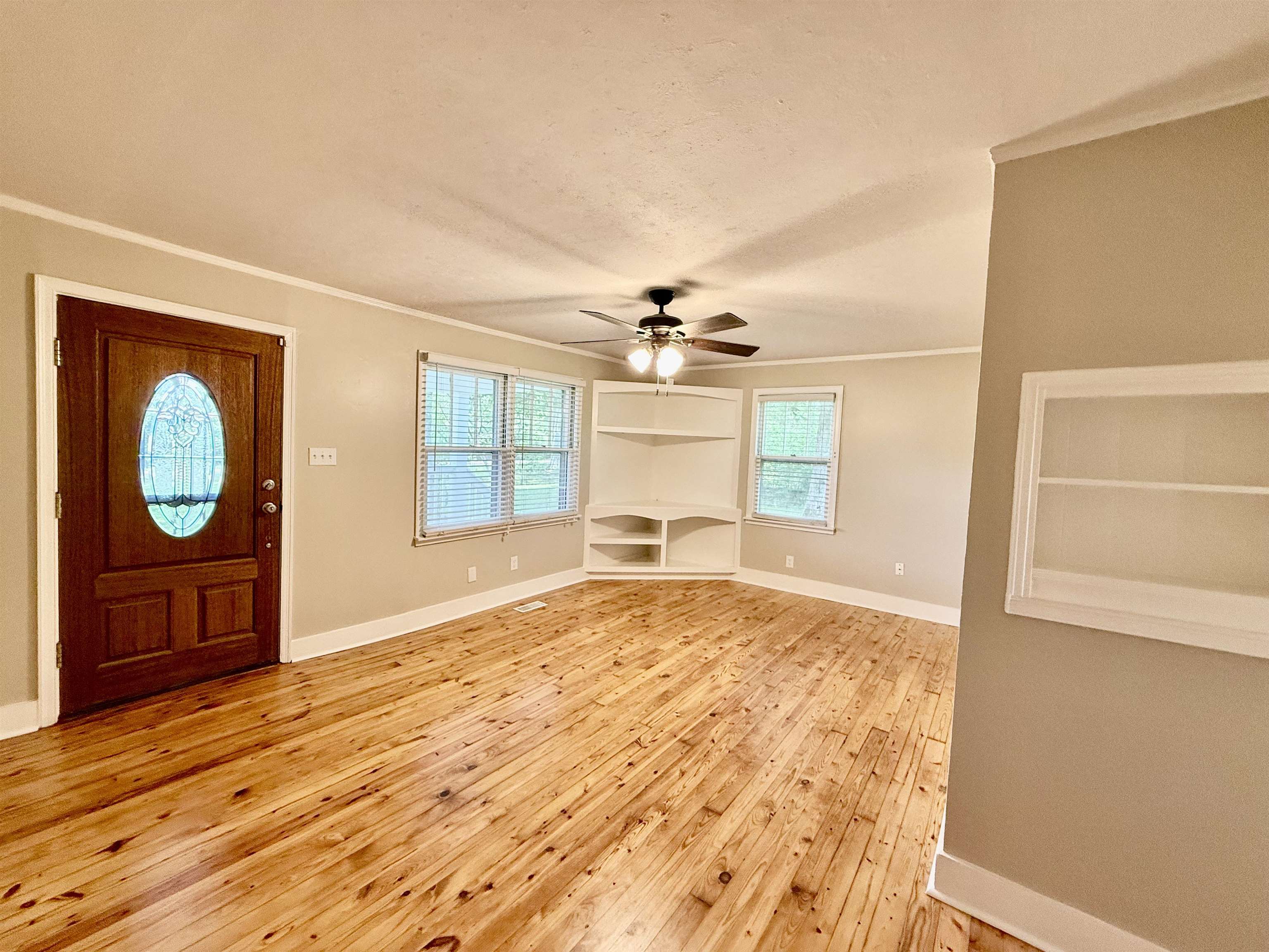 4120 Chambers Chapel Road Lakeland, TN 38002 - Photo 13 of 38 Entrance foyer featuring crown molding, baseboards, light wood-style flooring, and ceiling fan