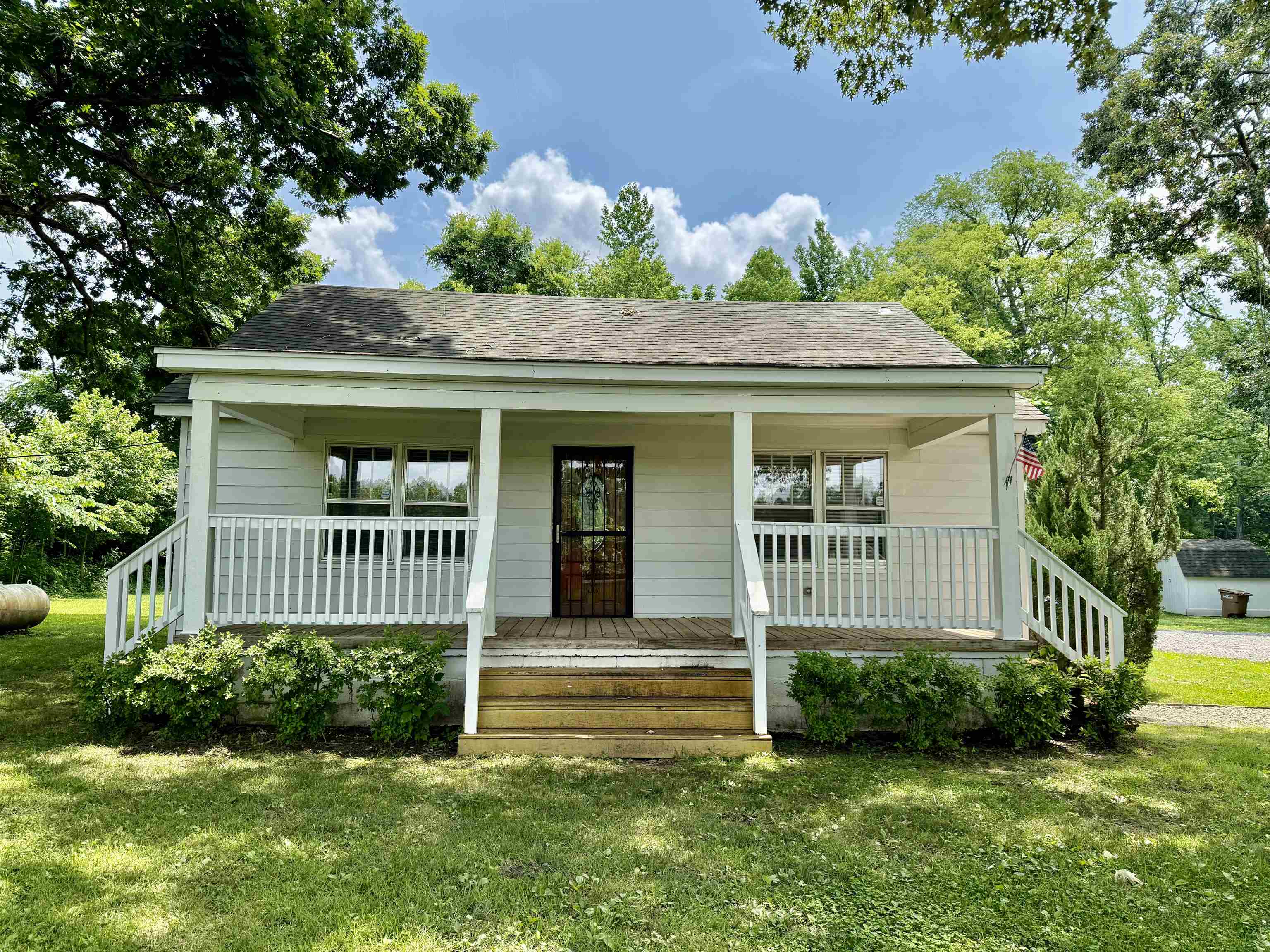 4120 Chambers Chapel Road Lakeland, TN 38002 - Photo 3 of 38 View of front of property featuring a front yard, covered porch, and roof with shingles