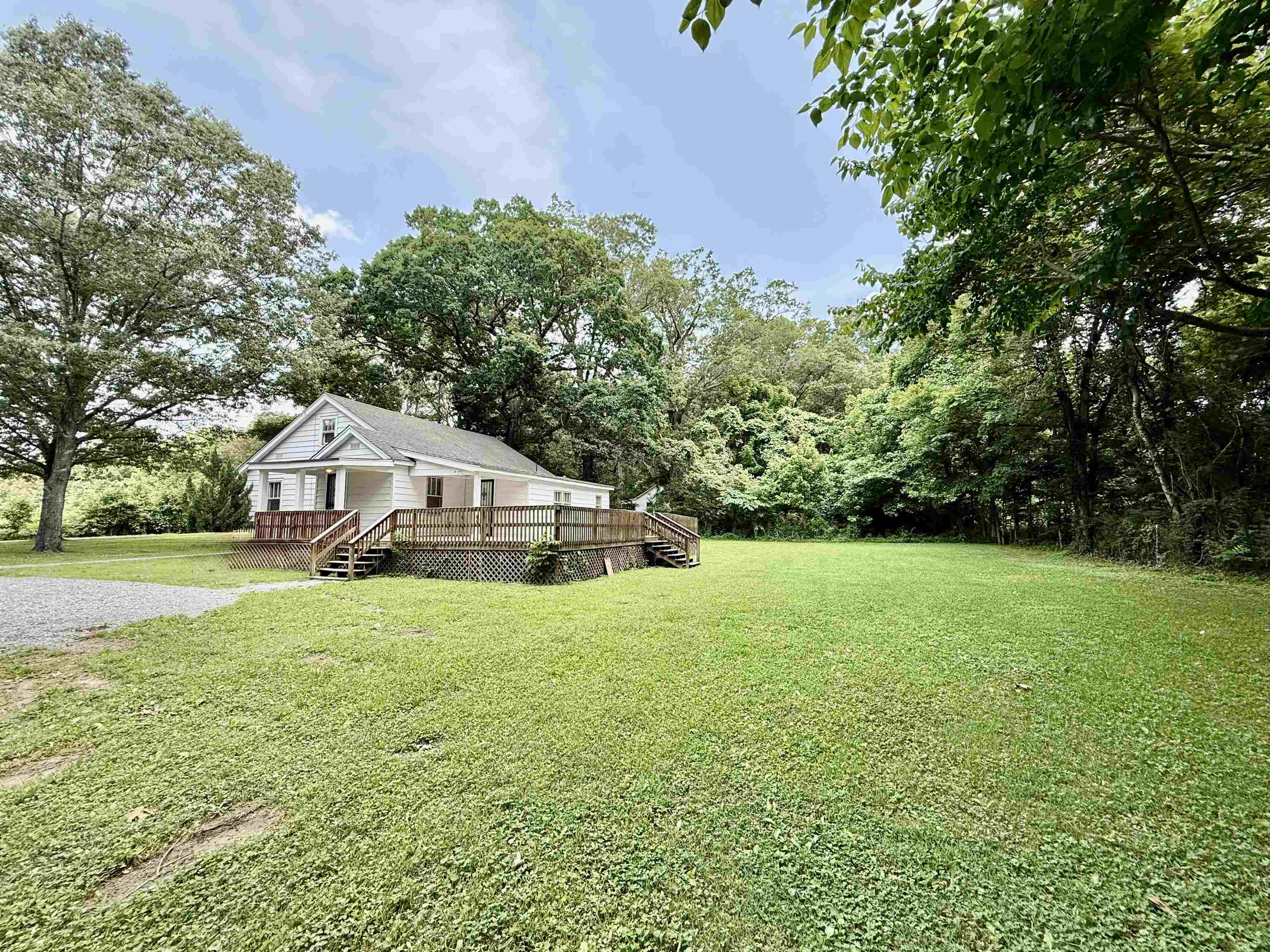 4120 Chambers Chapel Road Lakeland, TN 38002 - Photo 4 of 38 View of grassy yard featuring a wooden deck