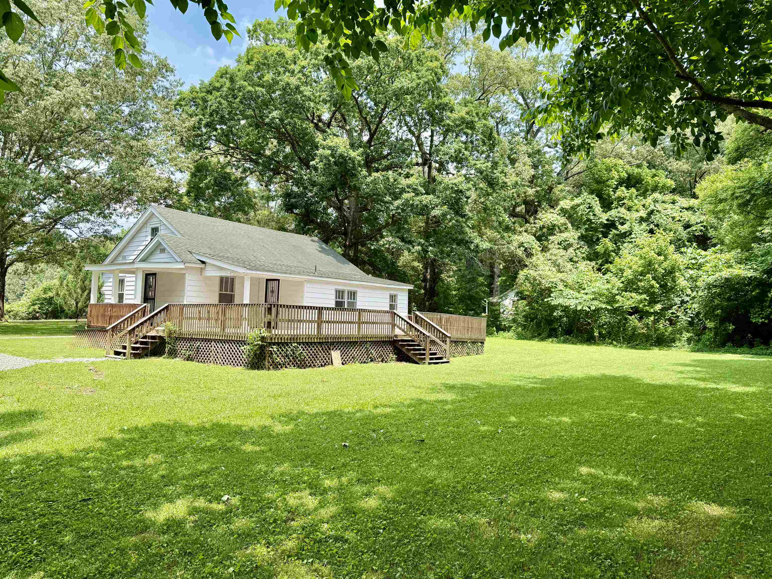 4120 Chambers Chapel Road Lakeland, TN 38002 - Photo 5 of 38 Back of house featuring a yard and a wooden deck
