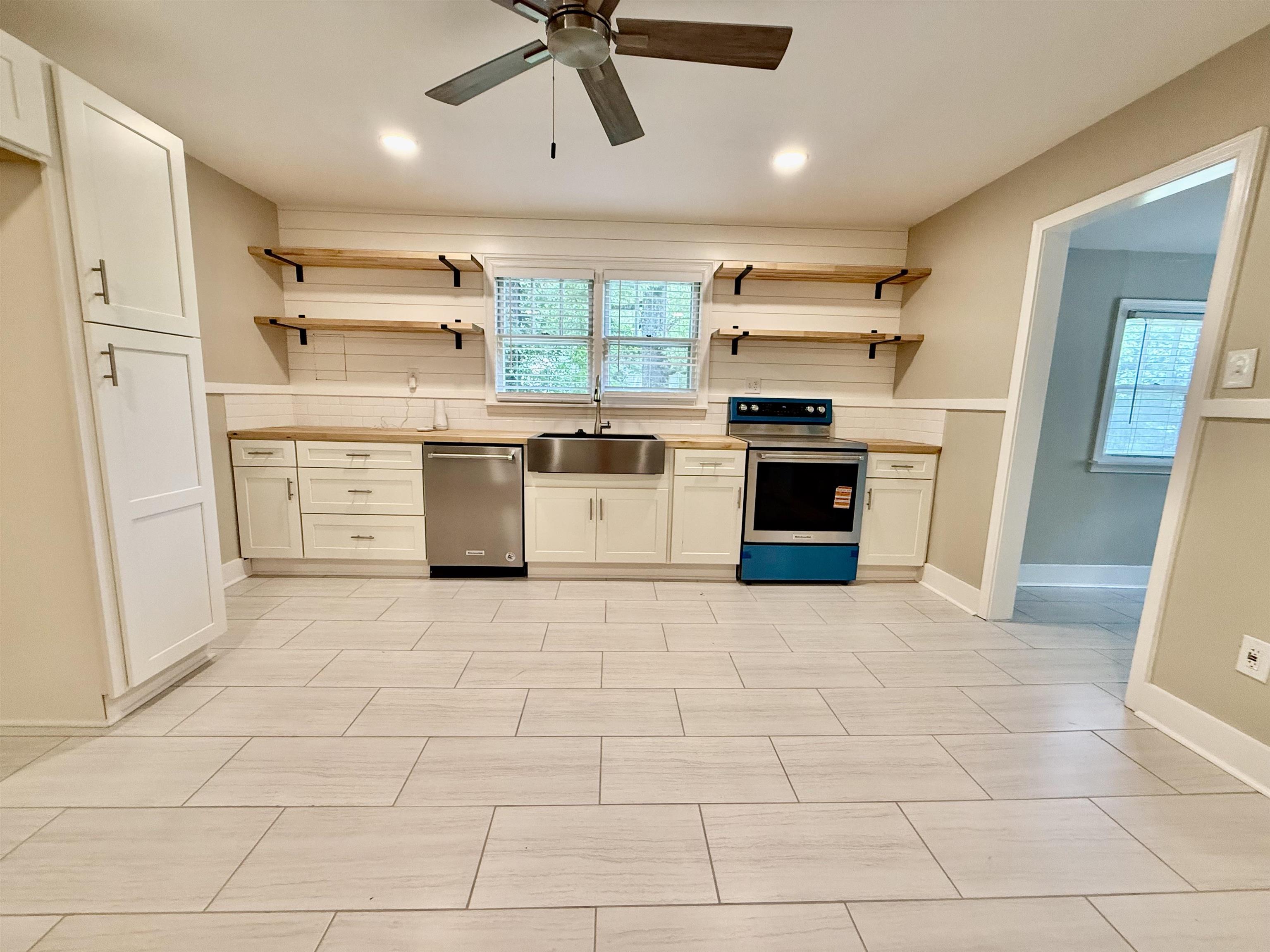 4120 Chambers Chapel Road Lakeland, TN 38002 - Photo 6 of 38 Kitchen with stainless steel appliances, a sink, open shelves, plenty of natural light, and recessed lighting