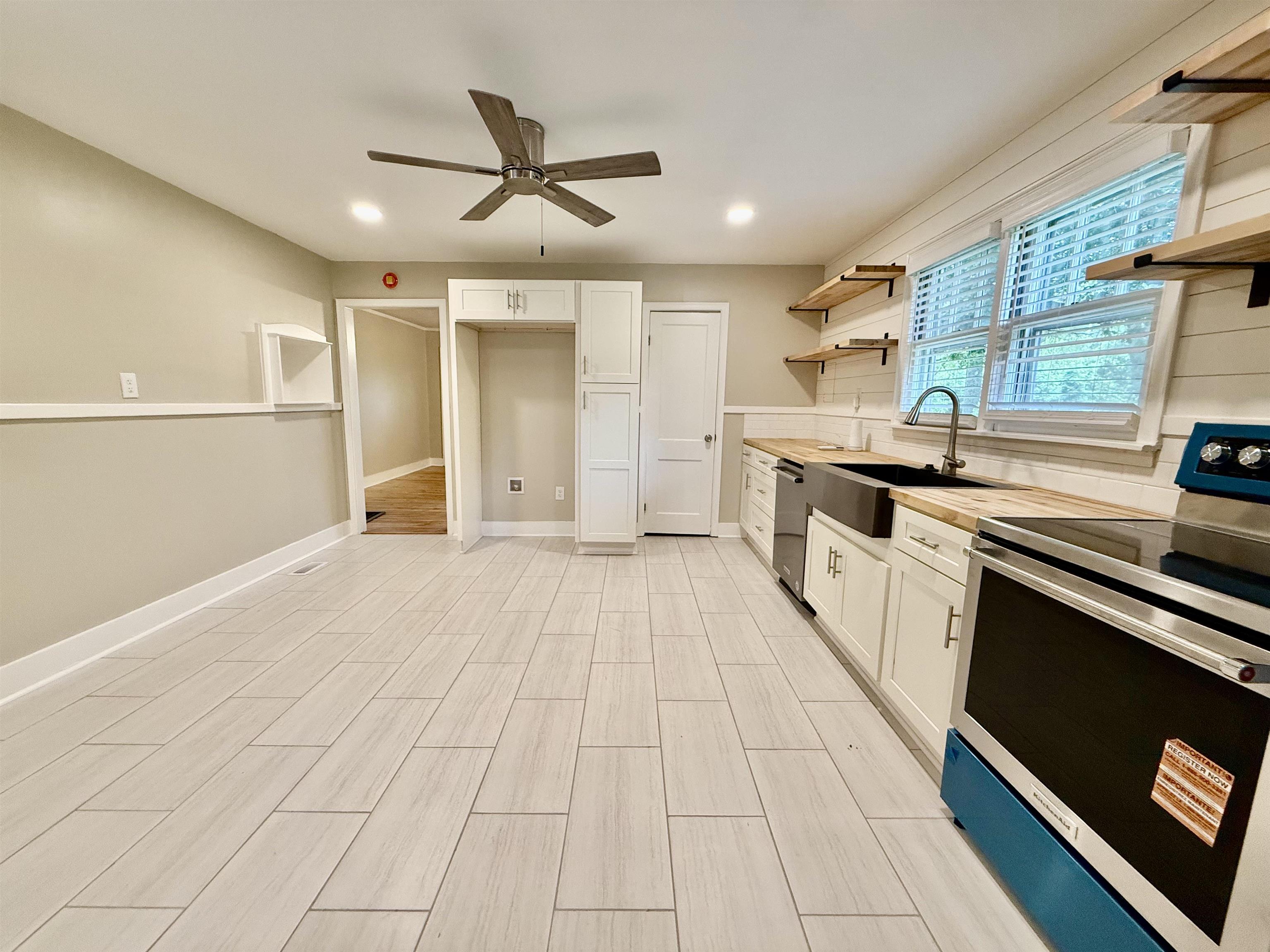 4120 Chambers Chapel Road Lakeland, TN 38002 - Photo 9 of 38 Kitchen with appliances with stainless steel finishes, open shelves, a sink, ceiling fan, and recessed lighting