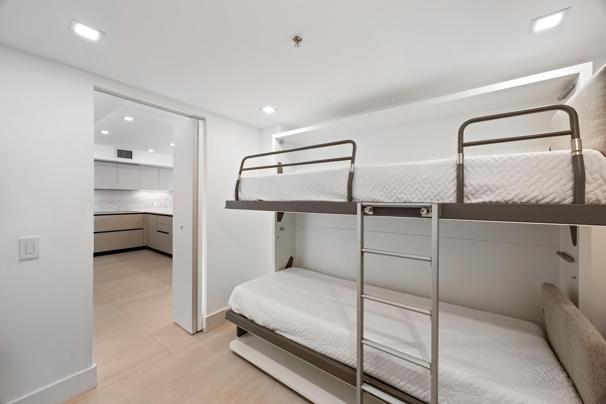 9499 Collins Avenue, Unit 603 Surfside, FL 33154 - Photo 19 of 42 Den w/ 2 murphy beds