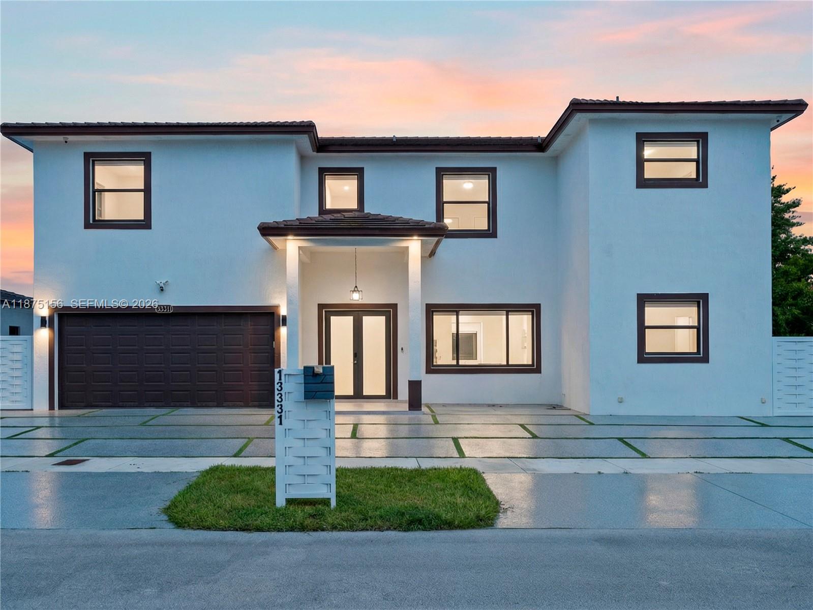 a front view of a house with yard