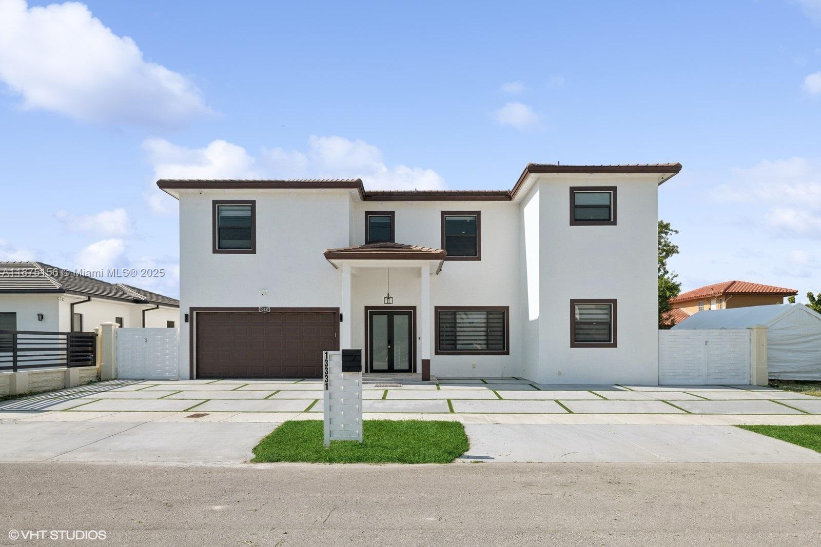 a front view of a house with garage