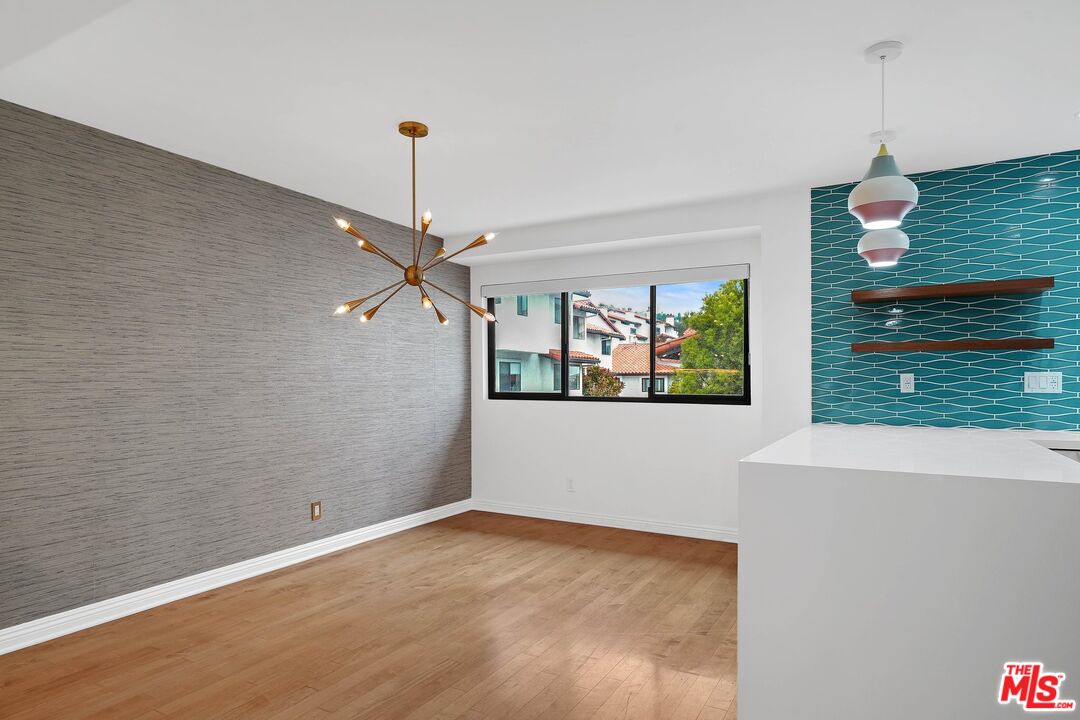 1569 Michael Lane Pacific Palisades, CA 90272 - Photo 12 of 31 a view of a room with a ceiling fan and window