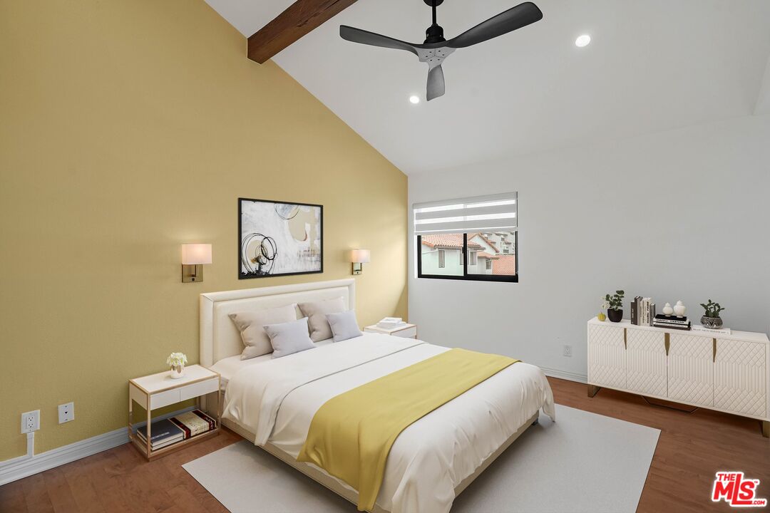 1569 Michael Lane Pacific Palisades, CA 90272 - Photo 28 of 31 a bedroom with a bed and a lamp on the wall