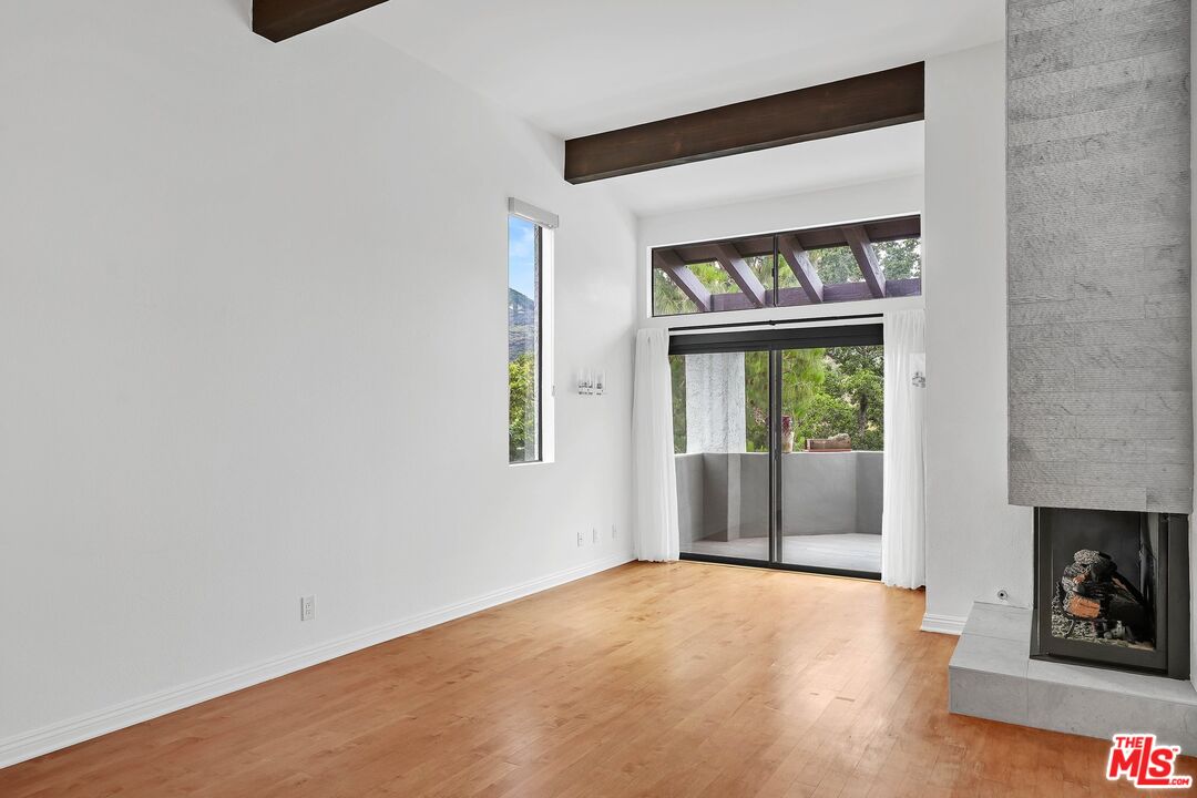 1569 Michael Lane Pacific Palisades, CA 90272 - Photo 5 of 31 wooden floor in an empty room with a window