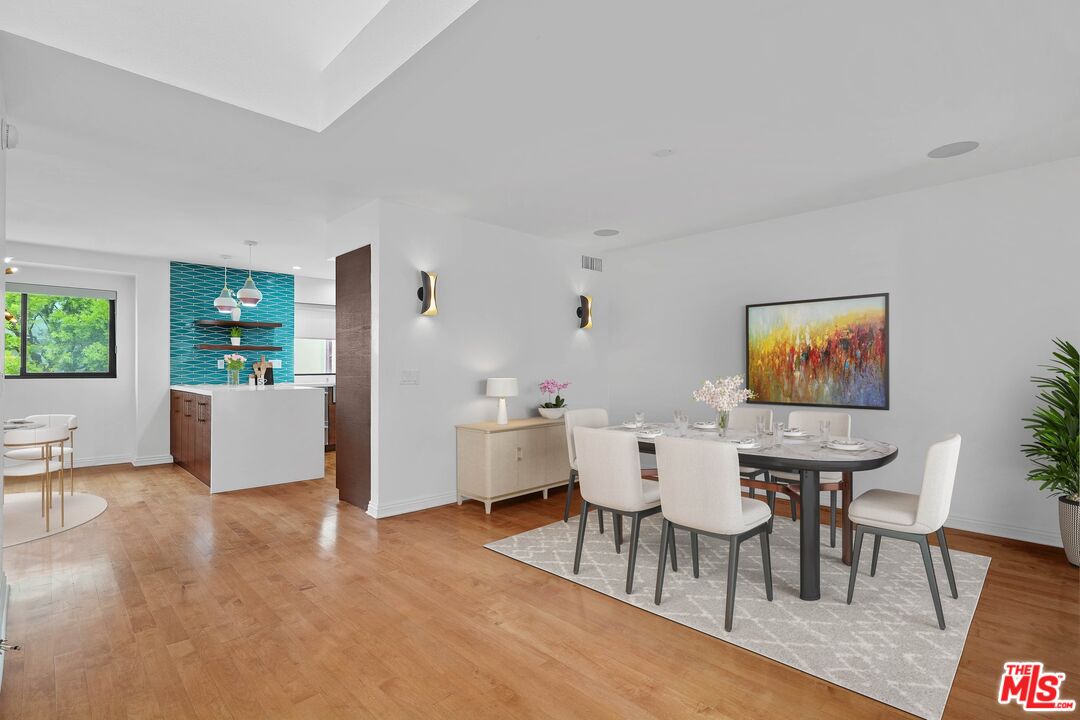 1569 Michael Lane Pacific Palisades, CA 90272 - Photo 9 of 31 a view of a dining room with furniture and wooden floor