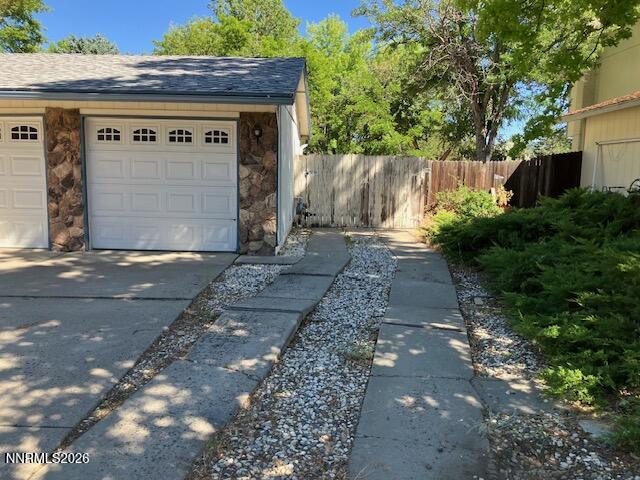 840 Meadow Springs Drive Reno, NV 89509 - Photo 15 of 23 a front view of a house with a garage