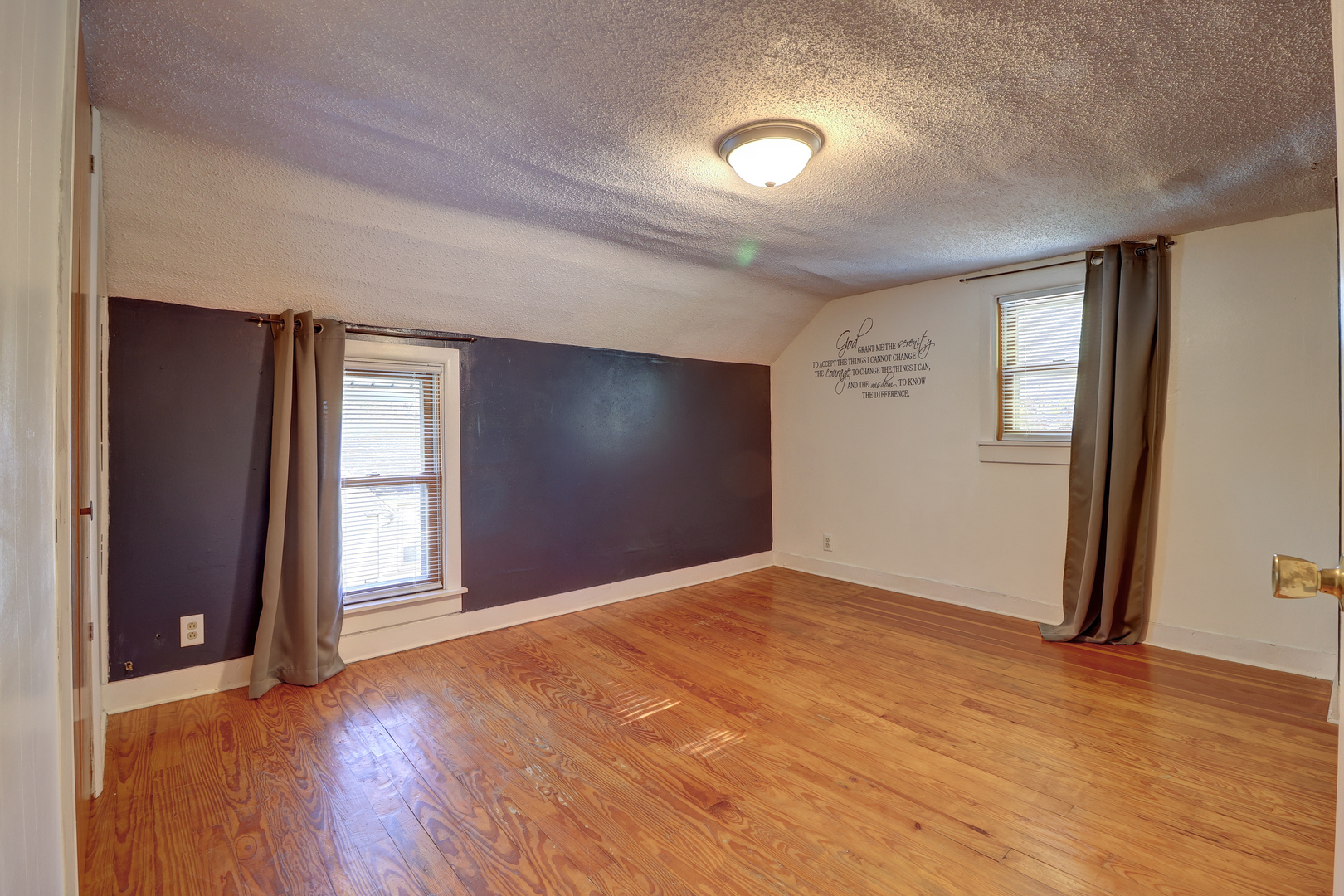 1305 3rd Avenue Sterling, IL 61081 - Photo 13 of 29 a view of an empty room with wooden floor and a window