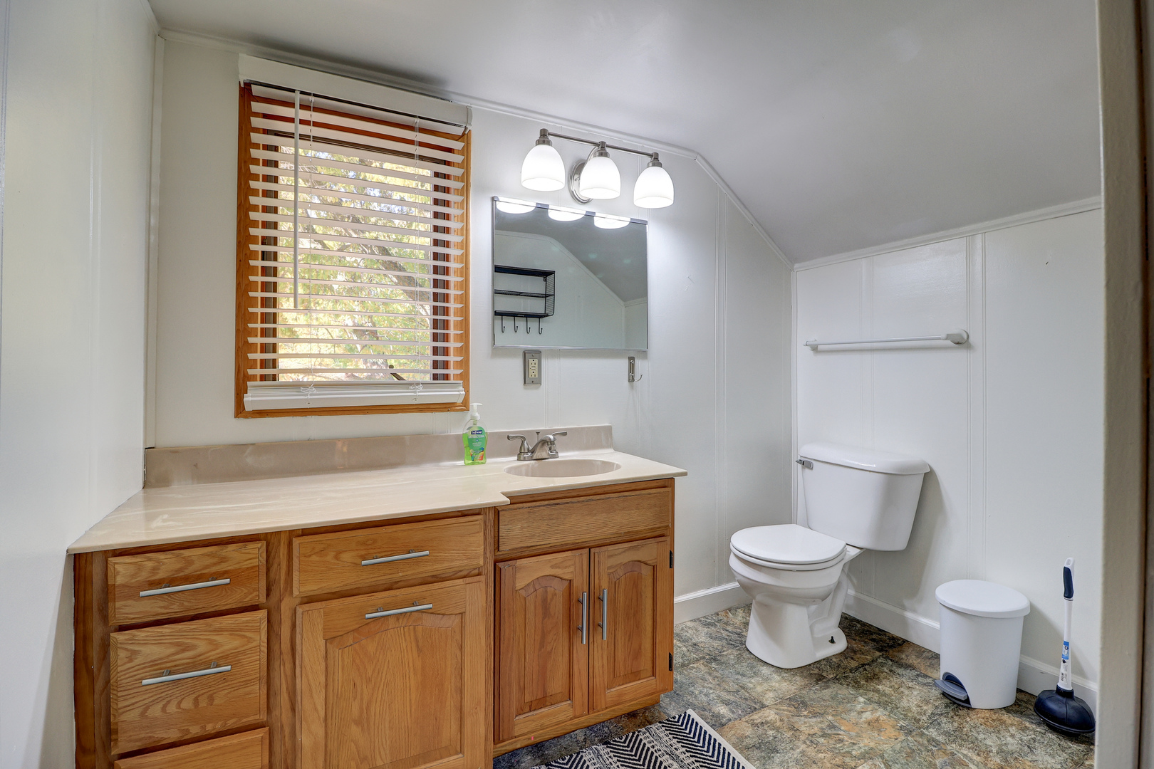 1305 3rd Avenue Sterling, IL 61081 - Photo 16 of 29 a spacious bathroom with a toilet sink and mirror