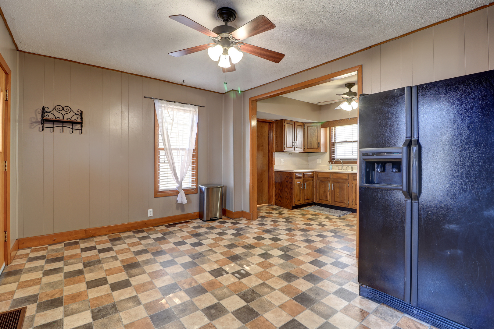 1305 3rd Avenue Sterling, IL 61081 - Photo 6 of 29 a large kitchen with window and stainless steel appliances
