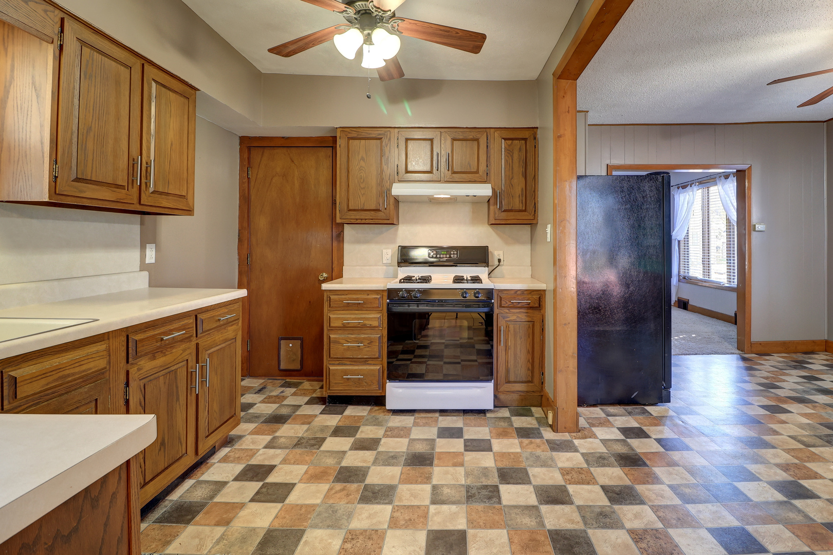 1305 3rd Avenue Sterling, IL 61081 - Photo 9 of 29 a kitchen with stainless steel appliances granite countertop a refrigerator a stove and a sink