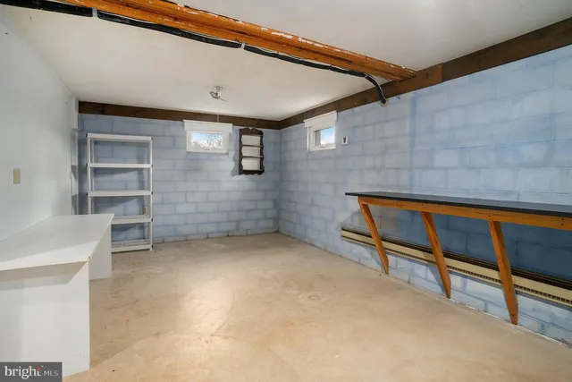 a view of an empty room with a staircase