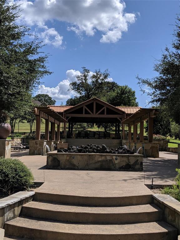 7710 Shore Crest Way Athens, TX 75752 - Photo 12 of 17 a front view of a house with a garden