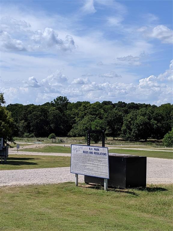 7710 Shore Crest Way Athens, TX 75752 - Photo 14 of 17 a view of a lake with a house in the background