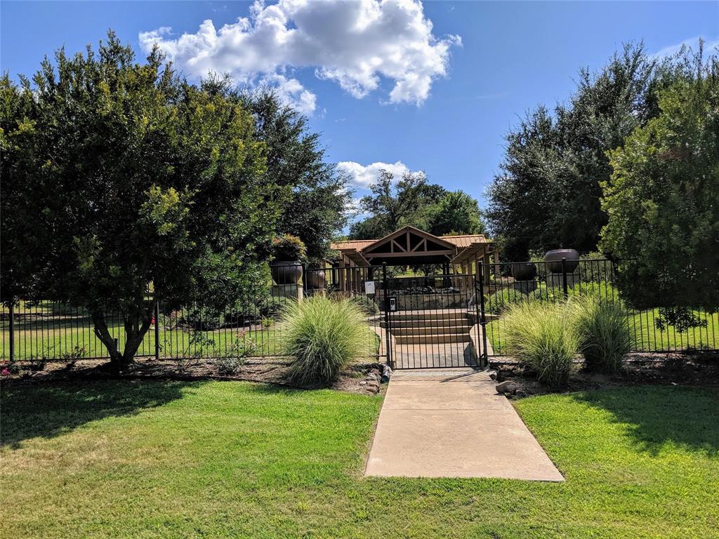 7710 Shore Crest Way Athens, TX 75752 - Photo 8 of 17 a front view of a house with a yard