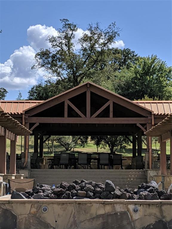 7710 Shore Crest Way Athens, TX 75752 - Photo 9 of 17 a view of a chair and table in the patio
