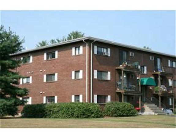 318 Codman Hill Road, Unit 34E Boxborough, MA 01719 - Photo 12 of 14 a front view of a house with plants