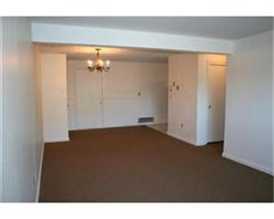 318 Codman Hill Road, Unit 34E Boxborough, MA 01719 - Photo 4 of 14 a view of a room with a ceiling fan