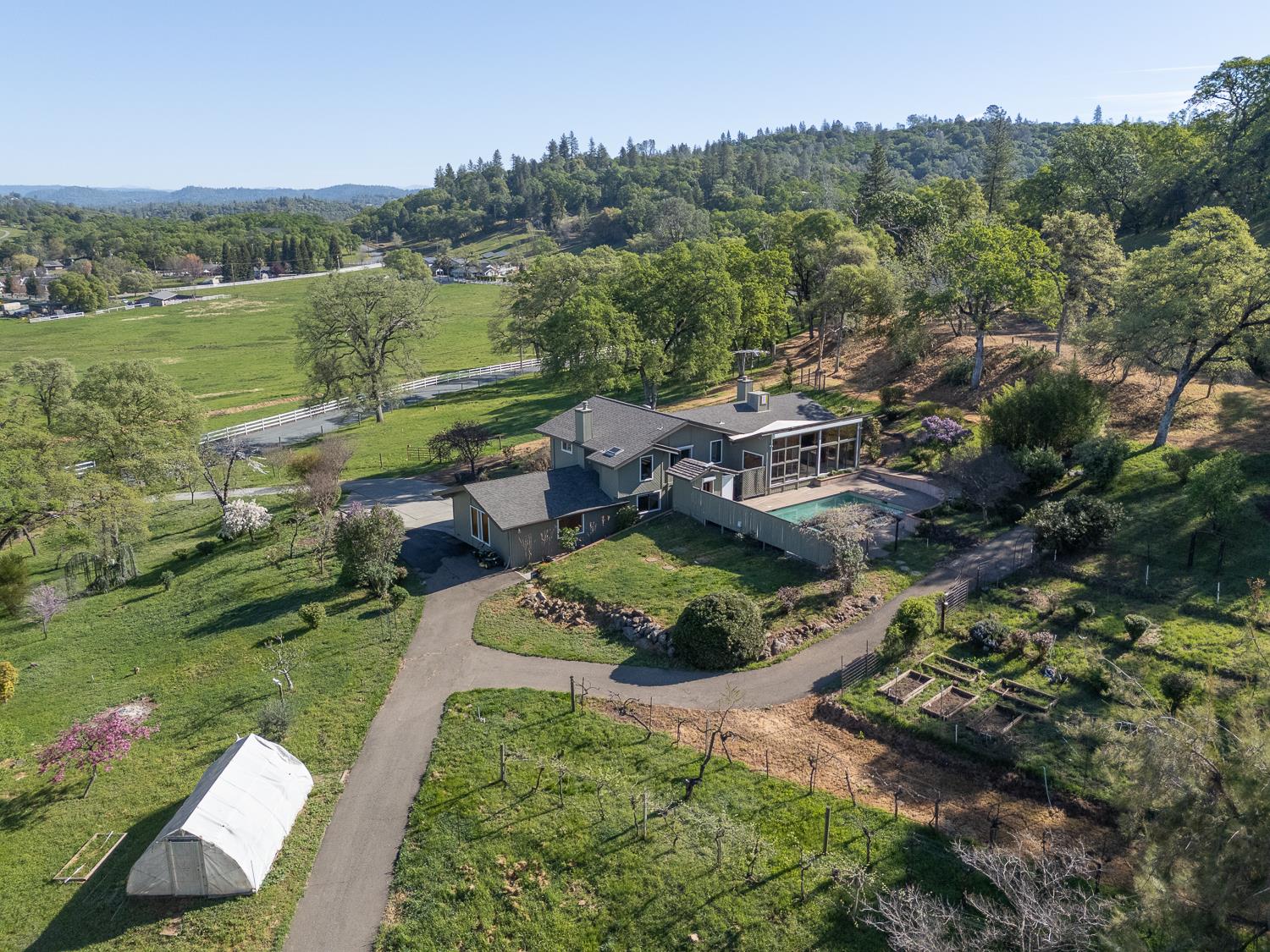 22801 Hidden Ranch Road Auburn, CA 95602 - Photo 12 of 94 an aerial view of a house with a garden and lake view