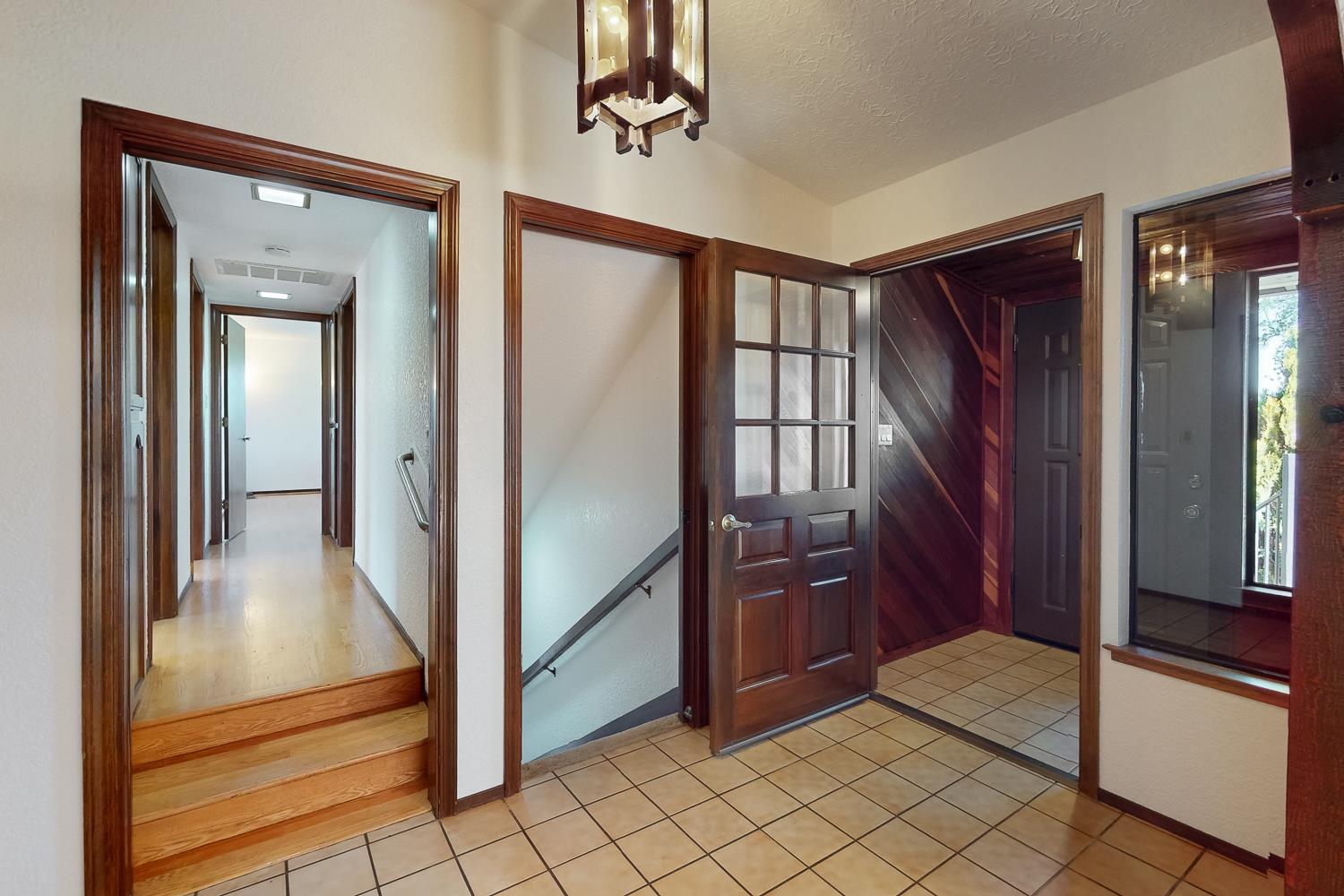 22801 Hidden Ranch Road Auburn, CA 95602 - Photo 14 of 94 a view of a hallway view with wooden floor and staircase