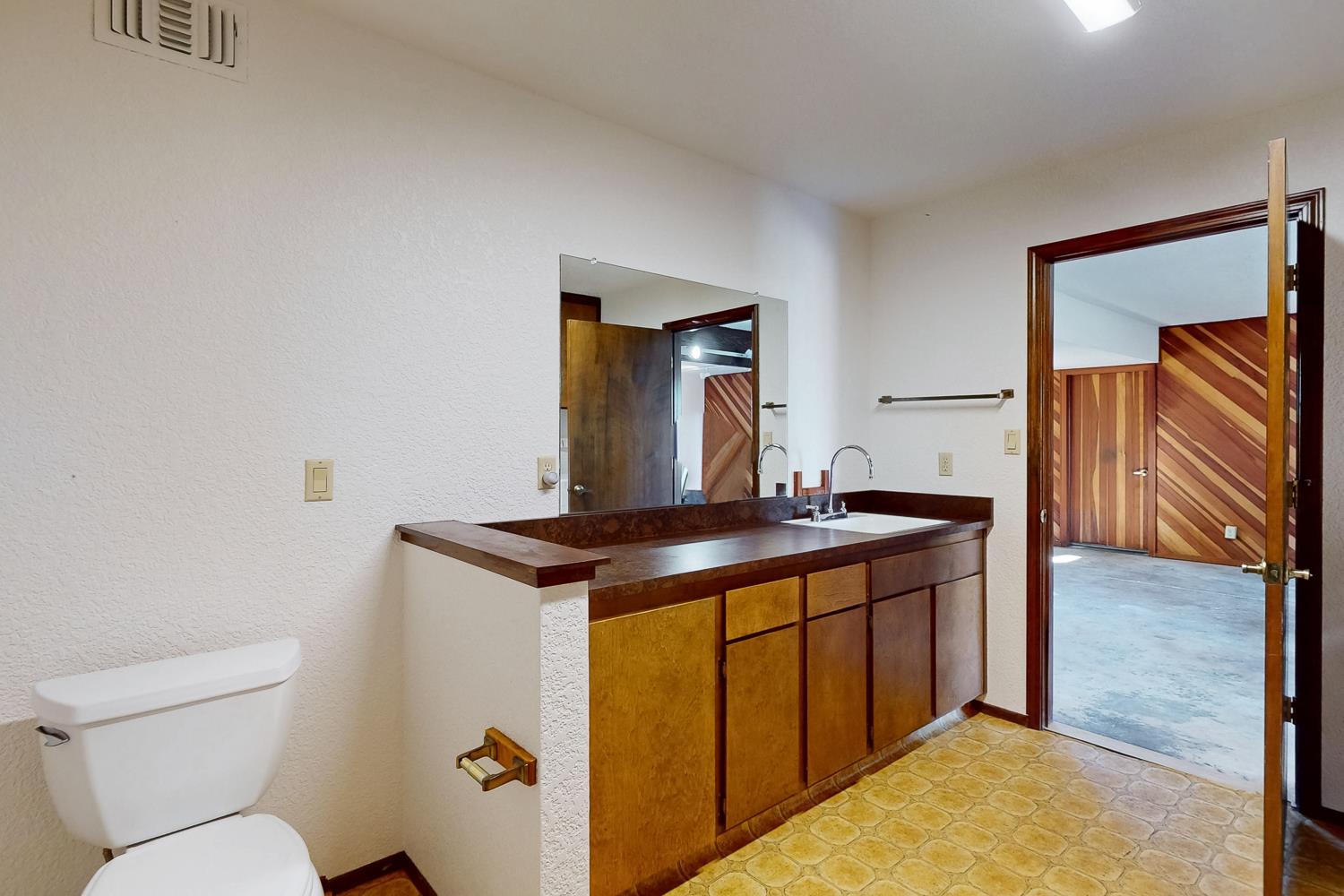 22801 Hidden Ranch Road Auburn, CA 95602 - Photo 47 of 94 a view of bathroom with a sink and mirror