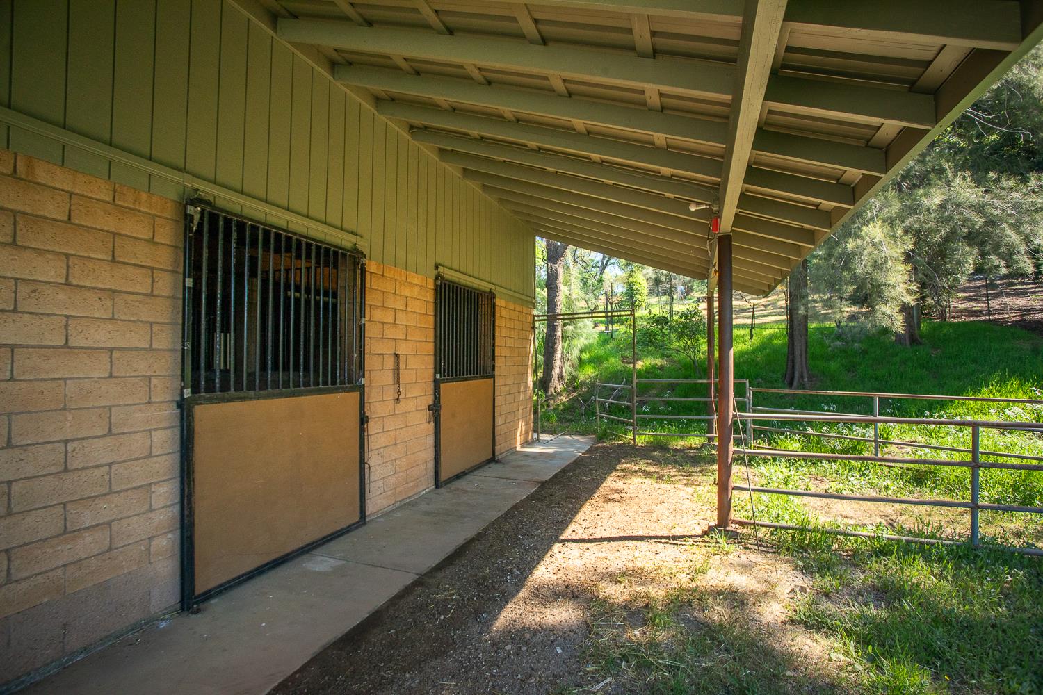 22801 Hidden Ranch Road Auburn, CA 95602 - Photo 58 of 94 a view of a porch with a floor to ceiling window and a yard