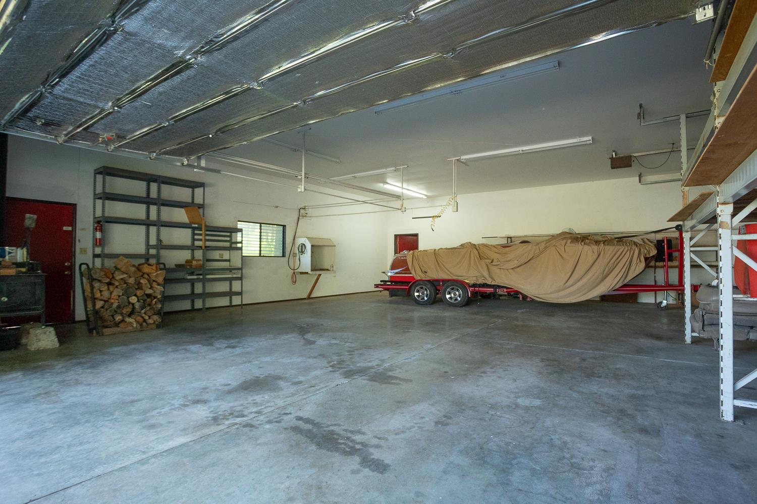 22801 Hidden Ranch Road Auburn, CA 95602 - Photo 69 of 94 a view of a garage with parked cars