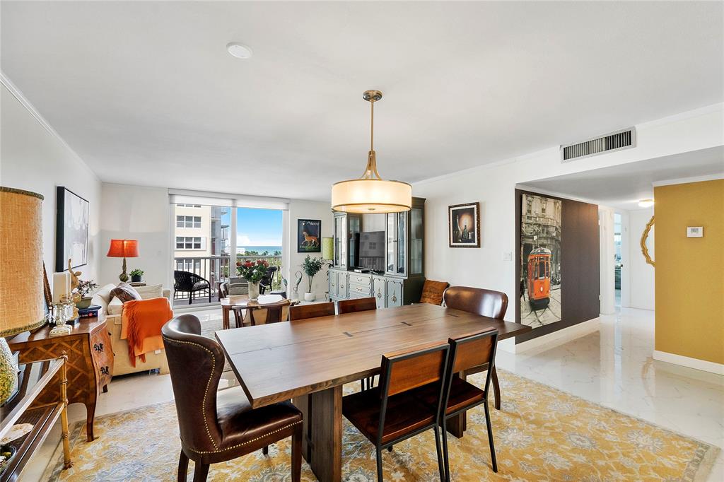 1601 South Ocean Drive, Unit 902 Hollywood, FL 33019 - Photo 11 of 40 a dining room with furniture window and wooden floor