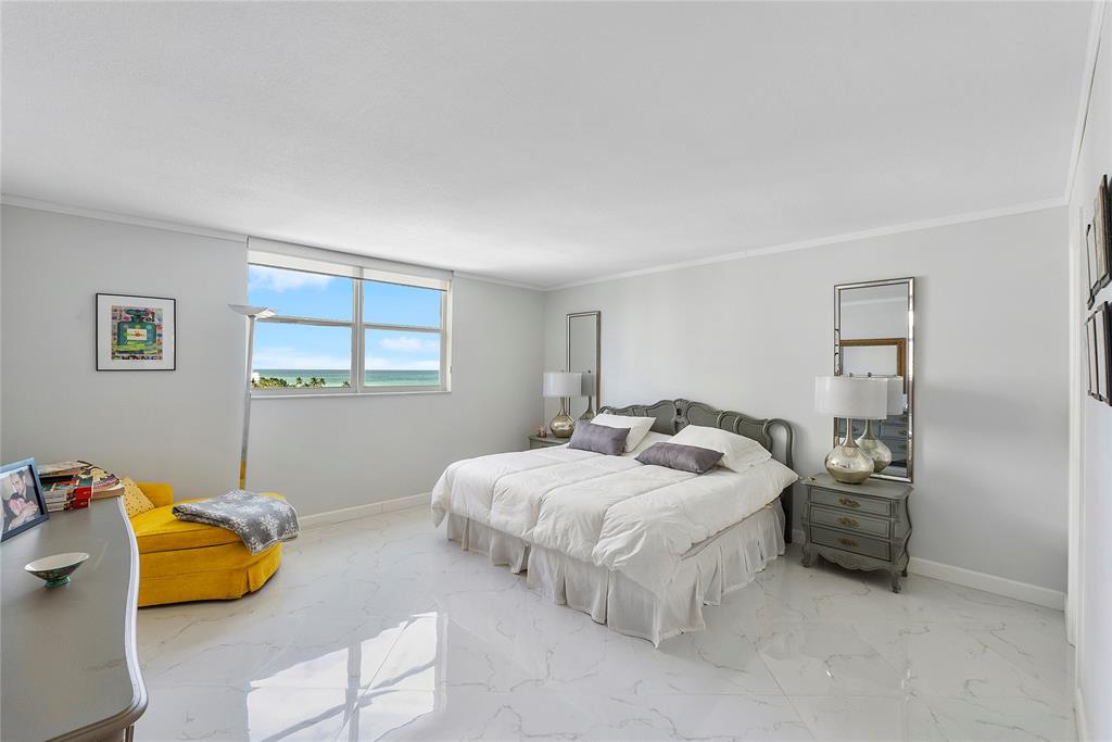 1601 South Ocean Drive, Unit 902 Hollywood, FL 33019 - Photo 17 of 40 a bedroom with a bed and a couch