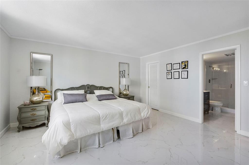 1601 South Ocean Drive, Unit 902 Hollywood, FL 33019 - Photo 20 of 40 a bedroom with a bed and a couch