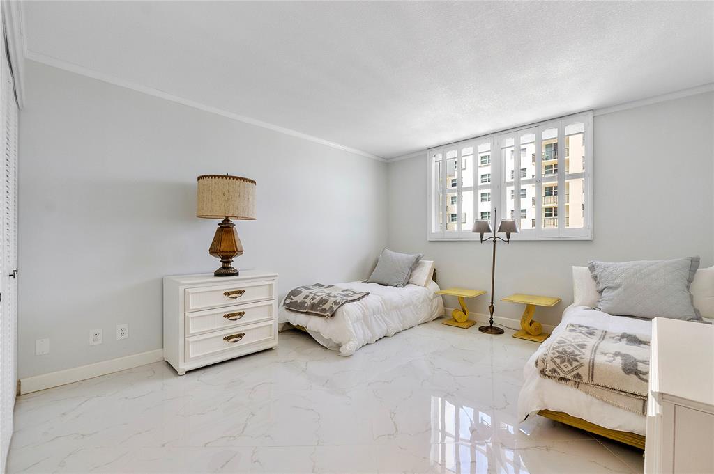 1601 South Ocean Drive, Unit 902 Hollywood, FL 33019 - Photo 25 of 40 a bedroom with furniture and a window