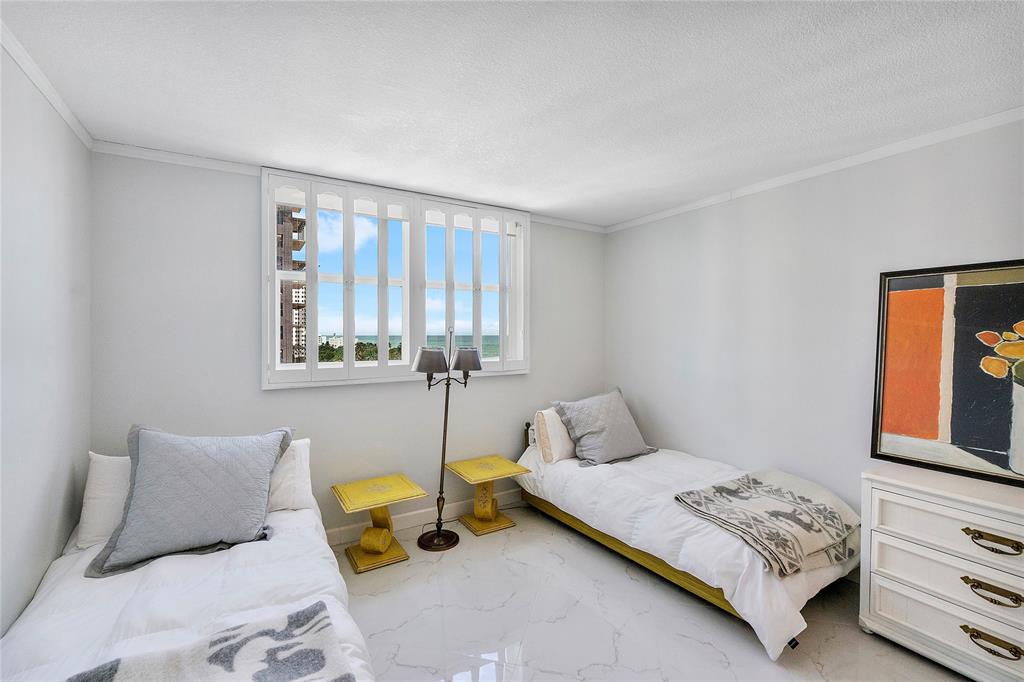 1601 South Ocean Drive, Unit 902 Hollywood, FL 33019 - Photo 26 of 40 a bedroom with a bed and window