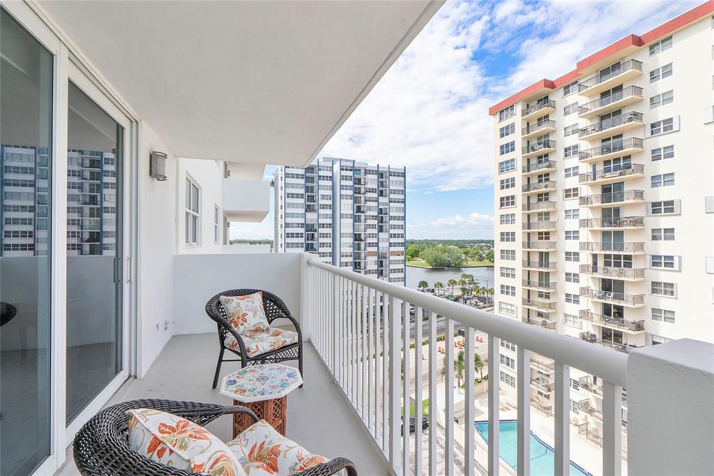 1601 South Ocean Drive, Unit 902 Hollywood, FL 33019 - Photo 30 of 40 a view of a balcony with chairs and iron fence